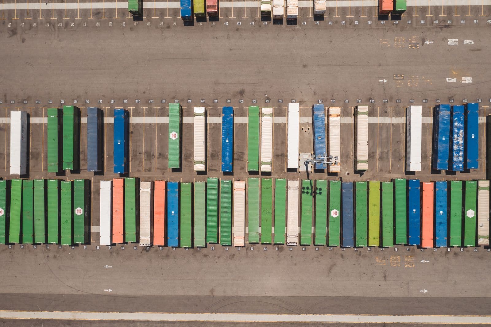 Overhead view of trailers lined up in rows across a clearance yard.